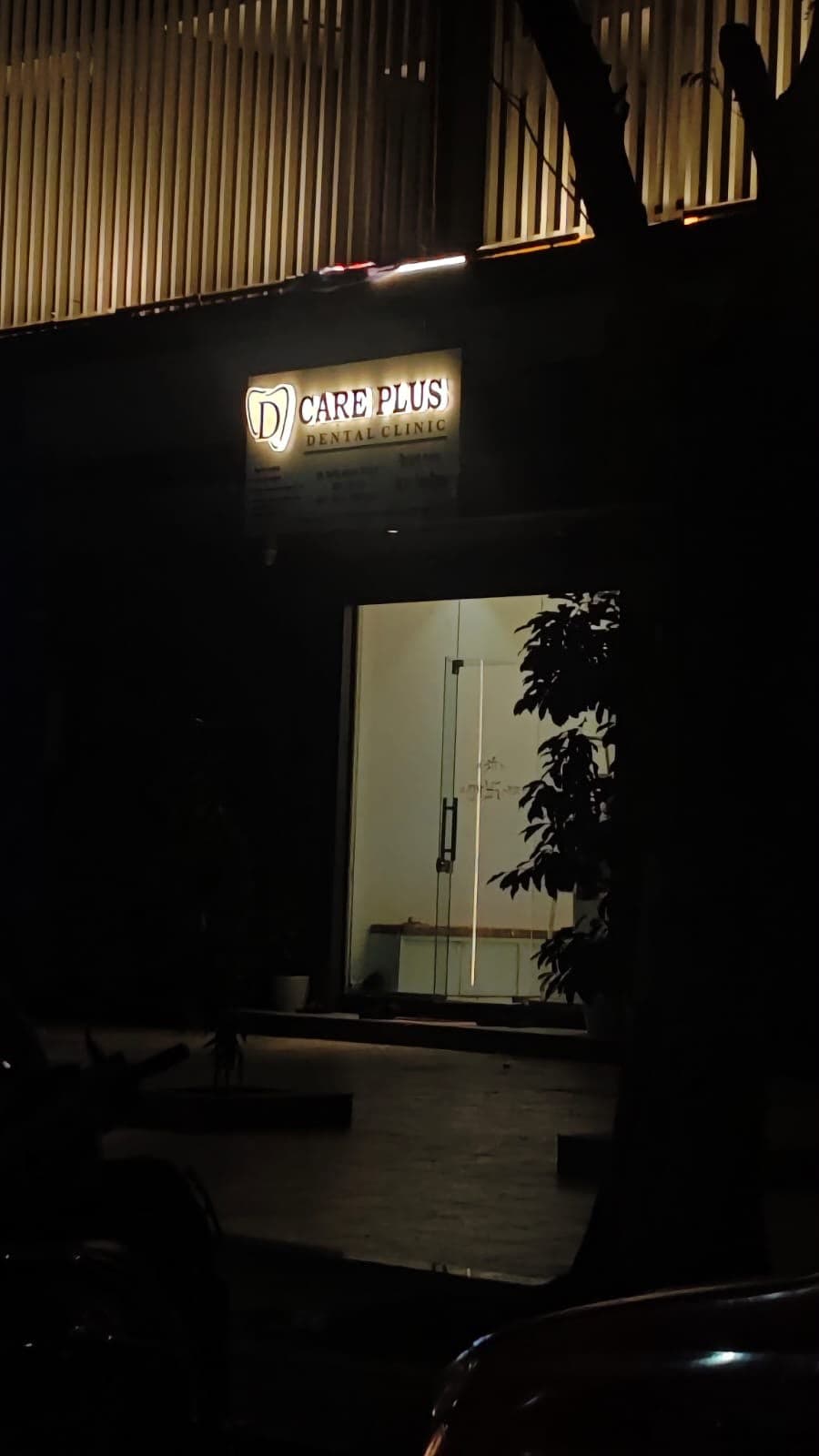The Care Plus Dental Clinic signboard and entrance in Sanpada, Navi Mumbai